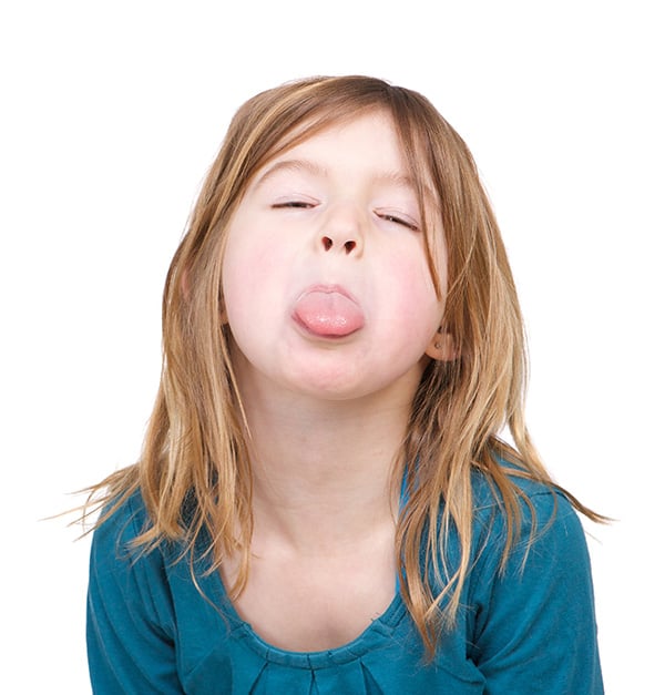 Child with tongue sticking out