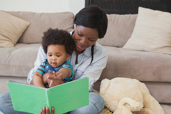 Mother reading to her baby